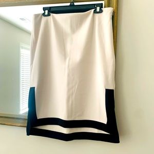 New with tags size 12 cream straight skirt with black accents on bottoms